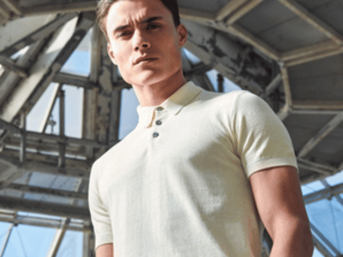 Image of a man in a light yellow polo shirt
