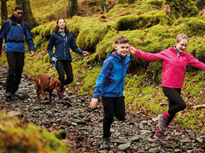 Regatta - A family wearing waterproofs hiking