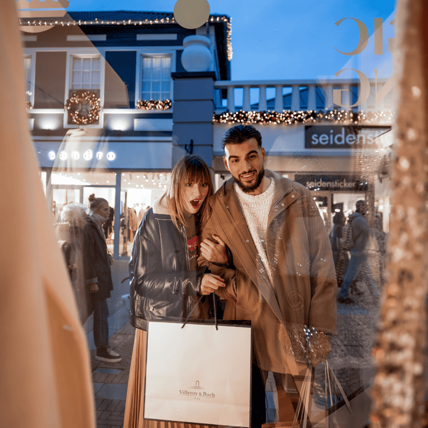 Couple window shopping at Designer Outlet Roermond