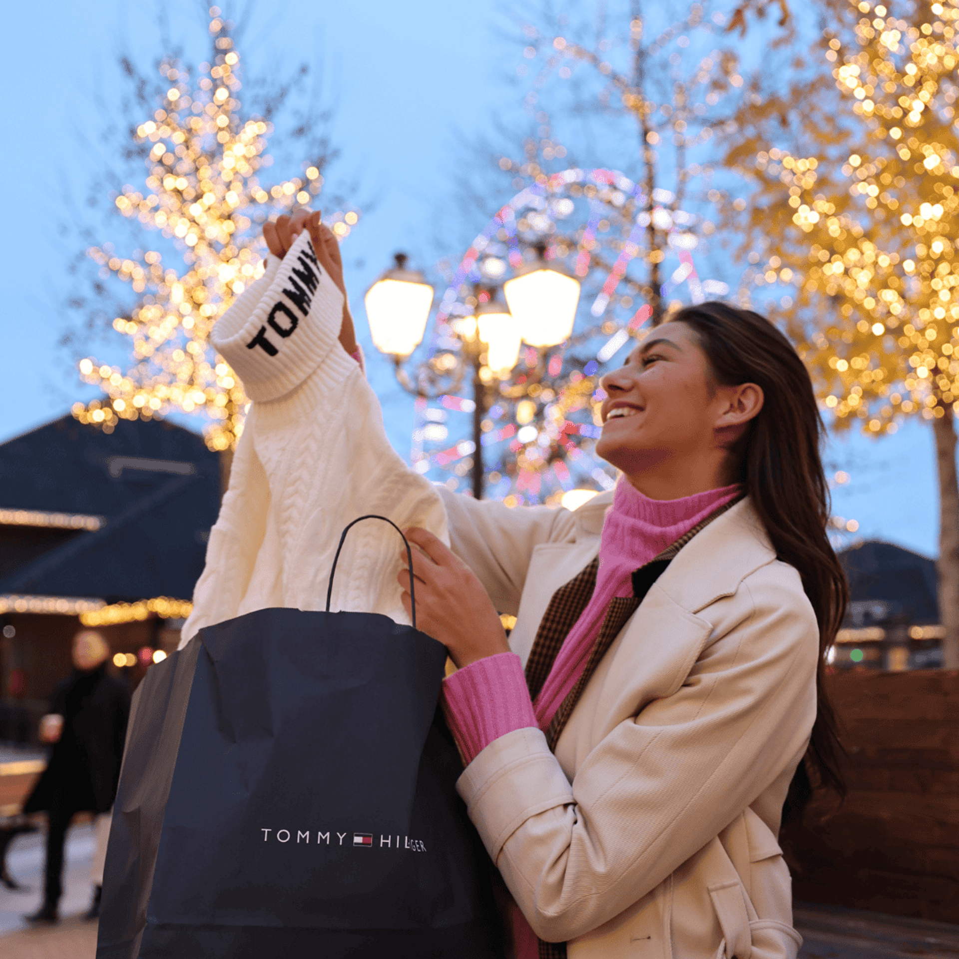 Young woman admiring her new Tommy Hilfiger Sweater